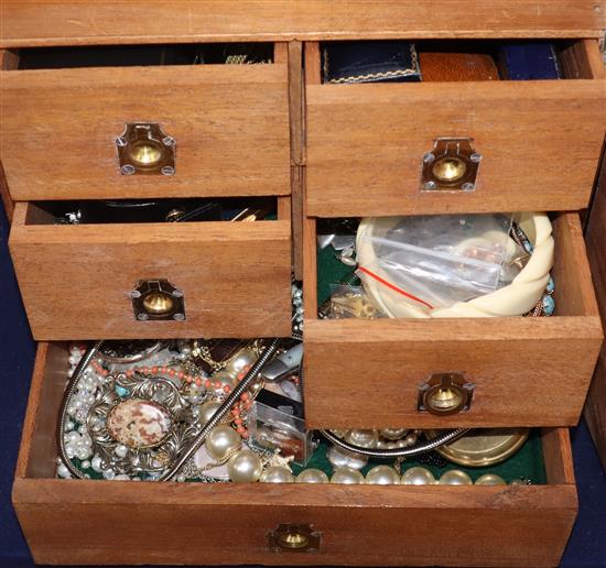 A quantity of assorted jewellery including coral necklace with 9ct clasp, 9ct cross pendant and costume, in a mahogany case.